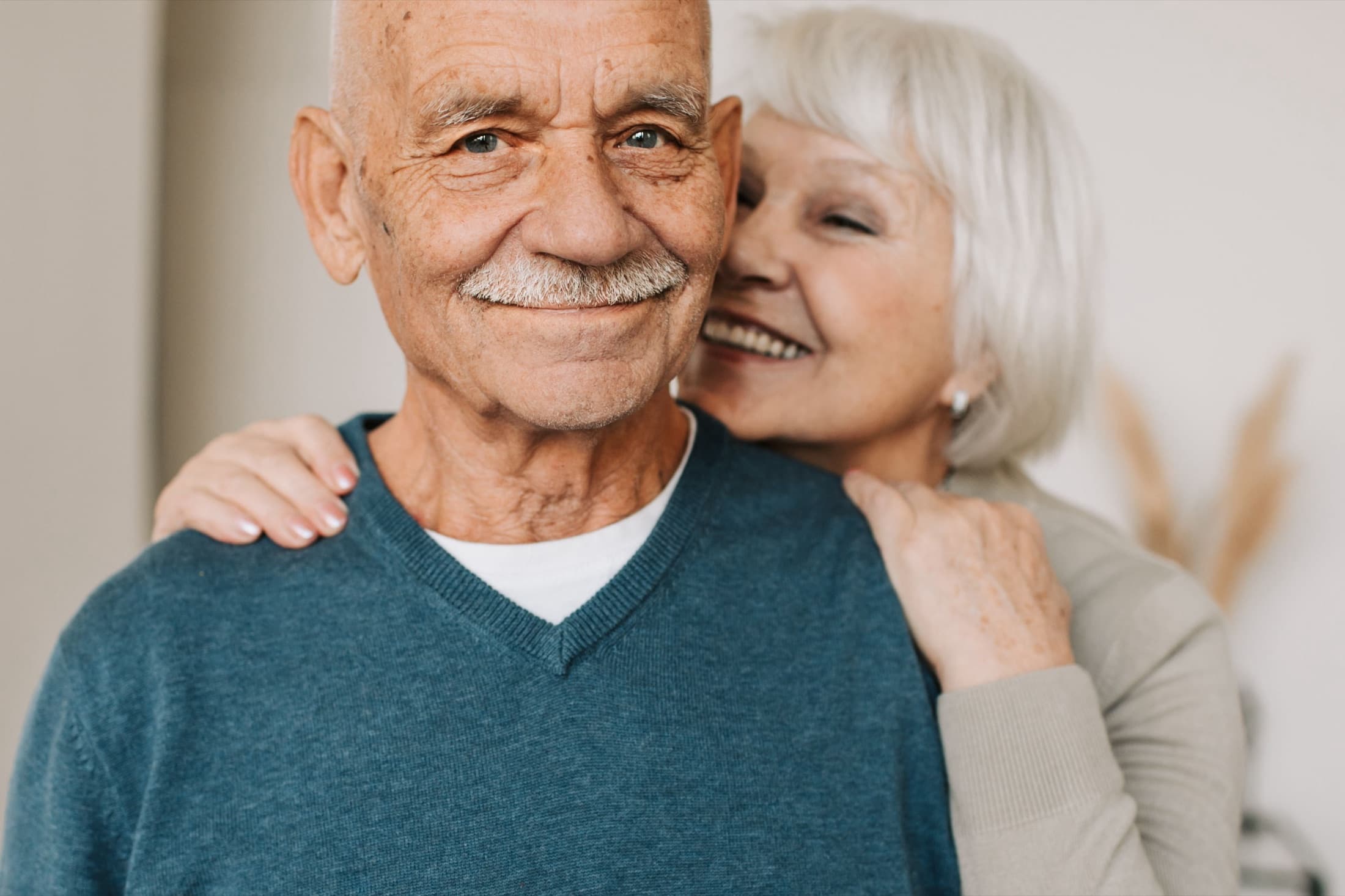 A smiling elderly couple